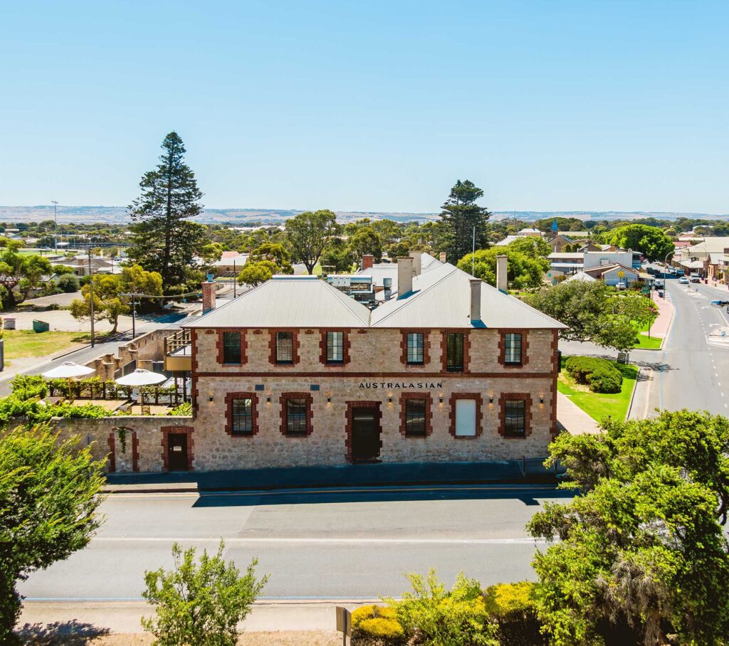 Exterior view of The Australasian Boutique Accommodation venue in Goolwa, South Australia — a heritage building offering luxury stays.